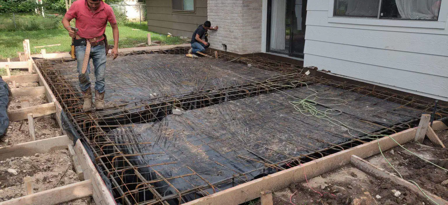 Concrete workers providing budget friendly concrete services for home project