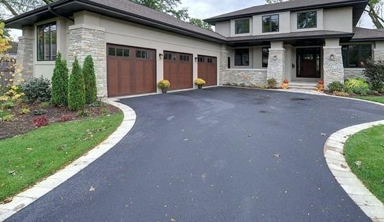 Driveway base preparation during professional driveway installation services