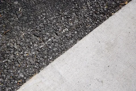 durable concrete vs asphalt driveway installed on residential property